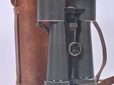 two binoculars sitting next to each other on a white surface