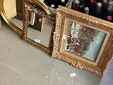 bottles of wine and a mirror are sitting on the floor