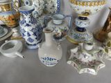 a lot of vases that are sitting on a table