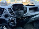 a dashboard of a car with a lot of cars in the background