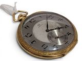 a gold pocket watch with roman numerals on the face