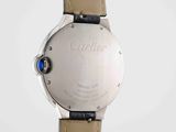a close up of a wrist watch on a white surface