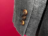 close up of a man ' s jacket with buttons on a mannequin mannequin mannequin mannequin mannequin mannequin manne