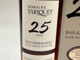 a bottle of wine sitting next to a box of wine