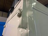 a close up of a white refrigerator in a room