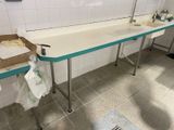 a white counter with a blue top in a bathroom