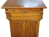 an old wooden table with a drawer on top of it