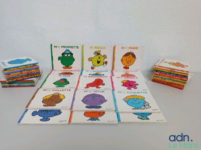many children ' s books that are on the table