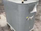 a large metal container sitting on the side of the road