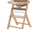 a wooden high chair with a tray on it