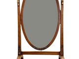 un miroir posé sur un pied, sur lequel est fixé un miroir