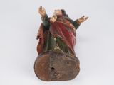 figurine of a man and a woman on a log on a white background