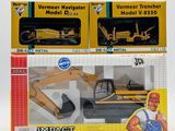 two boxed models of construction vehicles in the box