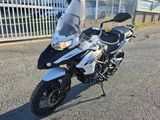 a motorcycle parked in front of a building on the street