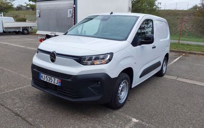 a white van that is parked in a parking lot