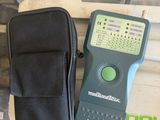 an image of a person holding a multimeter in their hand