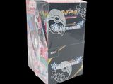 a box of pokemon trading cards on a black background