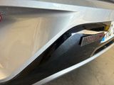 a close up of a car ' s bumper with a number plate on it