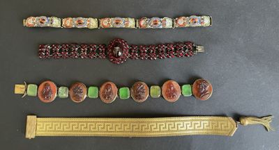 a lot of different bracelets and bracelets that are on a table