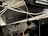 a lot of wires that are tangled up on a desk