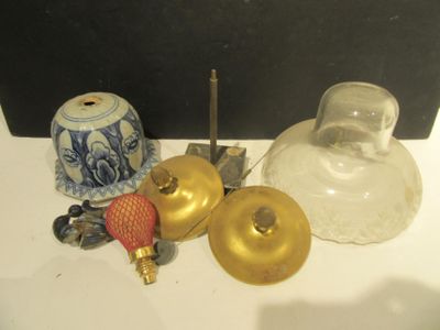a lot of glass and brass items on the table