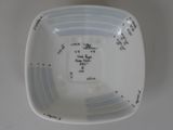 a bowl with a measuring scale in it on a table