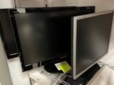two televisions that are sitting on top of a shelf