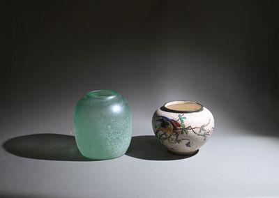 two vases sitting next to each other on a table
