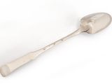 silver spoon with handle on a white background on a white surface