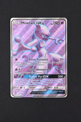 a close up of a pokemon card on a black surface