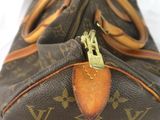 a close up of a brown louis vuitton bag