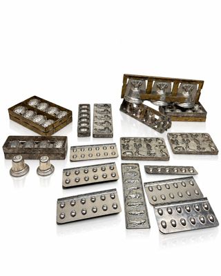 many different types of pills in a wooden box
