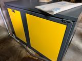 a yellow cabinet with a towel on top of it