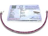 pink and silver beaded bracelet with a card attached to it
