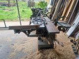 an image of a table sawing machine in a workshop