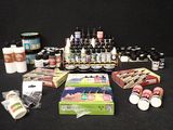 many different types of paint and supplies on the table