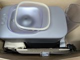 a box with a printer and other items inside of it