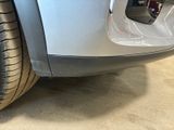 a close up of a car ' s tire on the ground