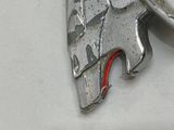 a silver keychain with a picture of a horse on it