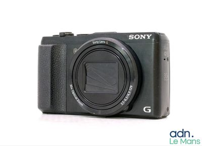 a camera that is sitting on a white surface