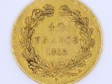 an image of a gold coin with a wreath of leaves on it
