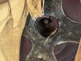 a close up of a piece of cloth with a metal object on it