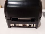 a black printer sitting on top of a white table