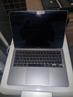a laptop computer sitting on top of a white table
