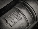 a black and white photo of an old fire hydrant