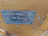 a close up view of a metal plate on the back of a tractor