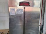 a picture of a double door refrigerator in a garage