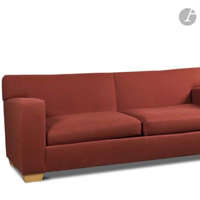 an image of a red couch sitting on top of a white floor