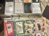 a suitcase full of cds sitting on the floor