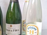 several bottles of wine are lined up next to each other